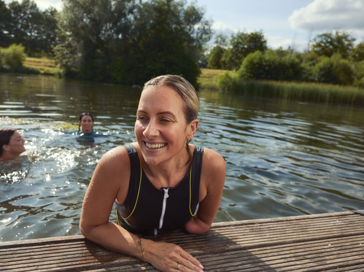 Woman swimming in the pond