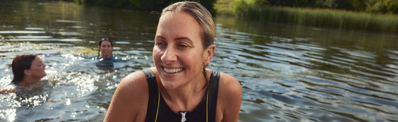 Woman swimming in the pond