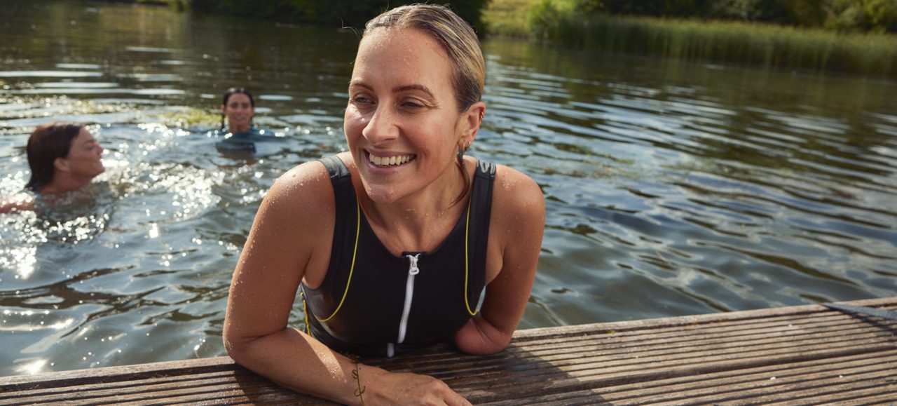 Woman swimming in the pond