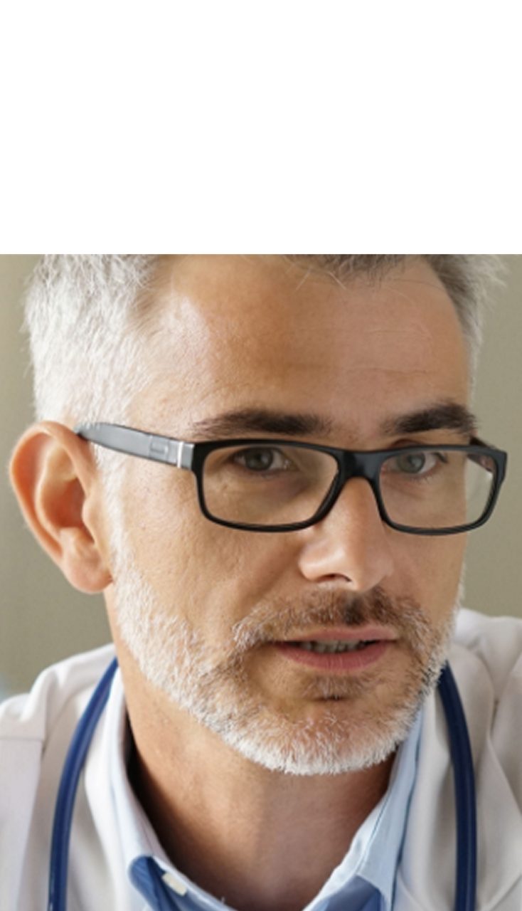 A doctor consulting a patient, illustrating Astellas’ commitment to improving access to medicines.