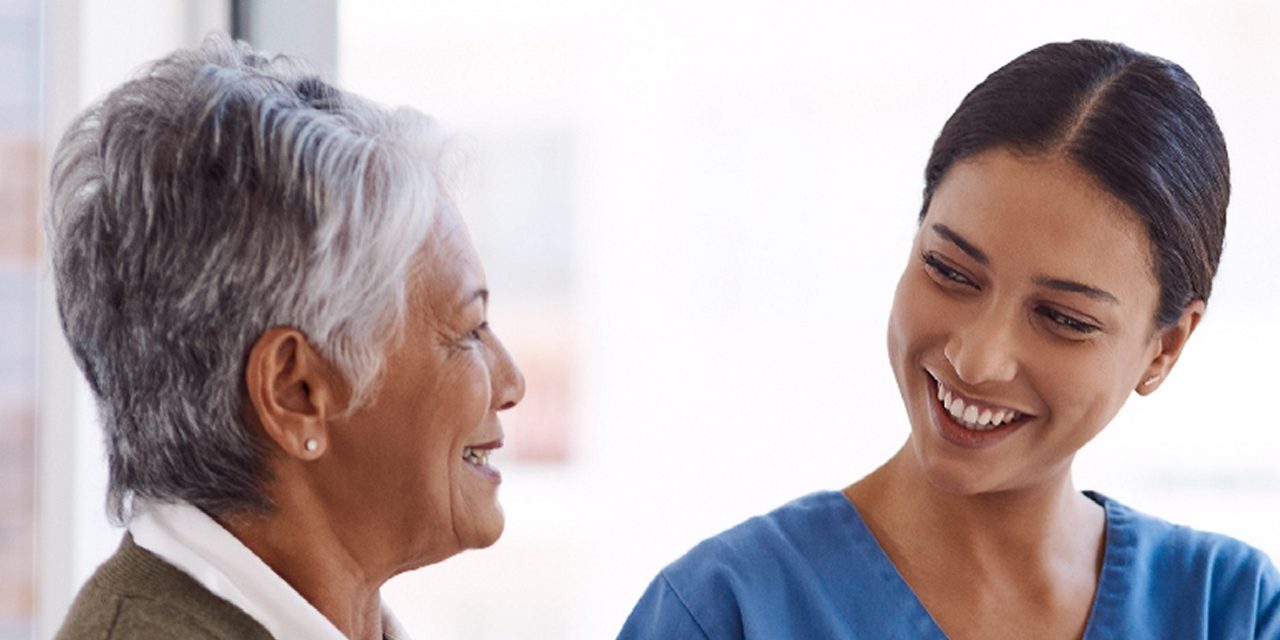 A healthcare professional consults with a patient, illustrating Astellas’ Access to Medicines commitment.