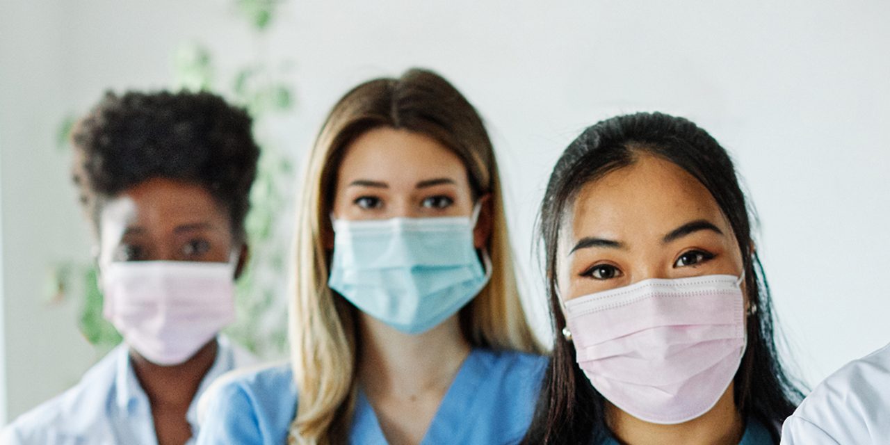 Masked healthcare professionals, illustrating how Astellas is addressing issues of Access to Health.