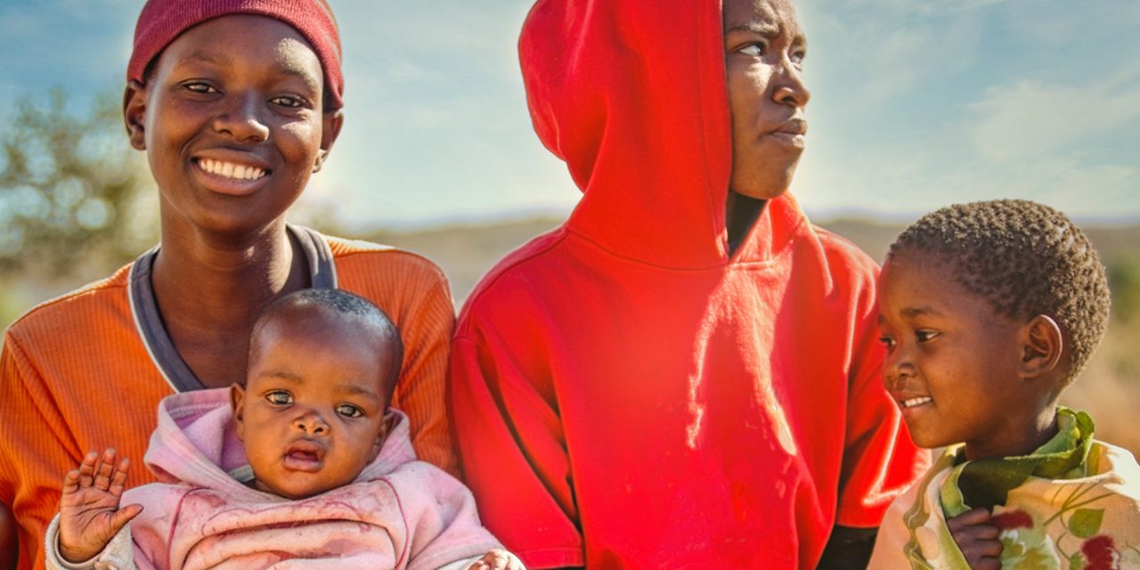  Mothers with their children, illustrating Astellas’ research activities on NTDs.