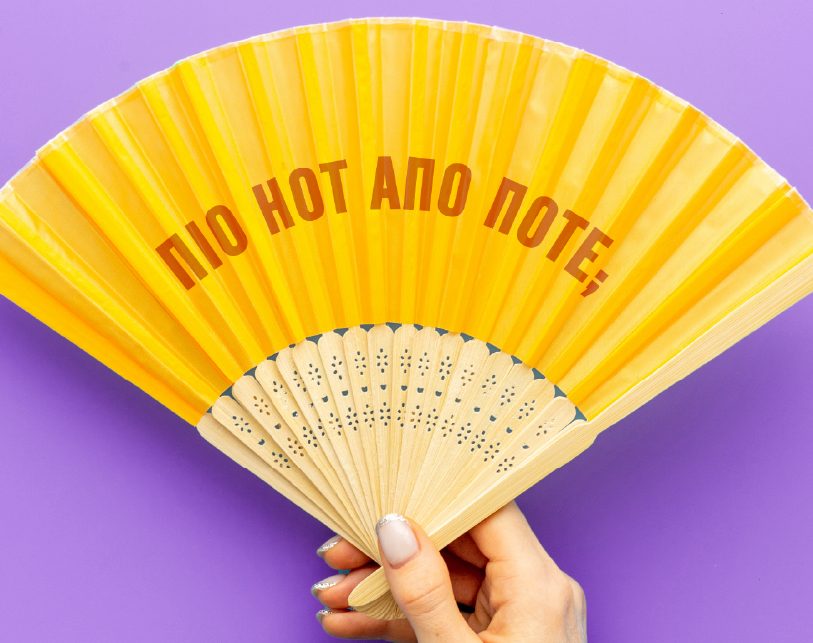 Woman smiling and fixing her top