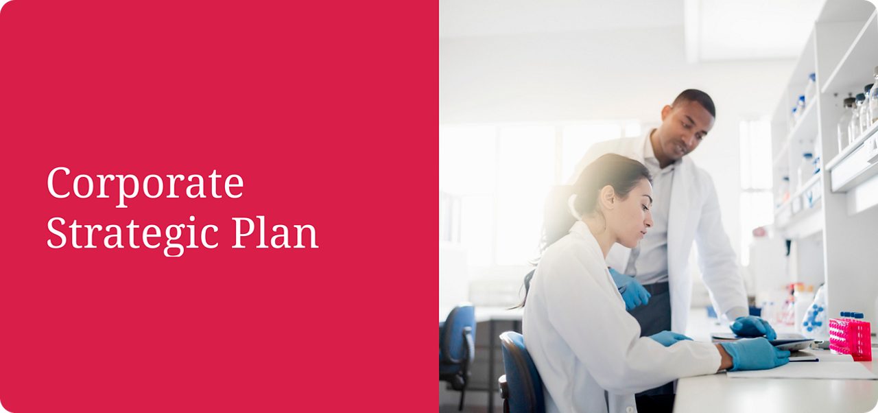 Astellas scientists examine samples under a microscope, reflecting the company’s research-driven mission.
