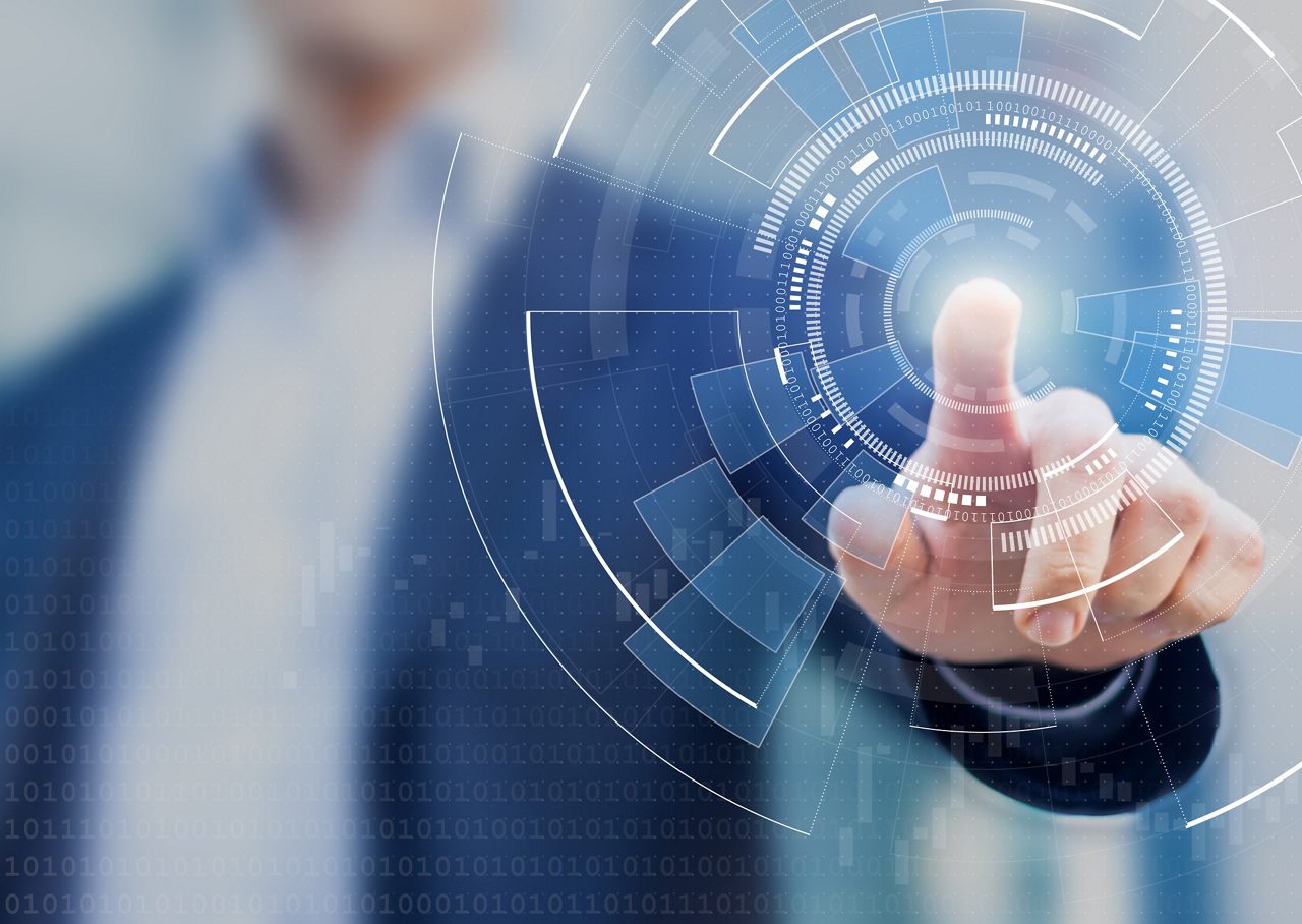 An executive reviews interactive financial data as part of Astellas’ Q3 FY2024 performance reporting.