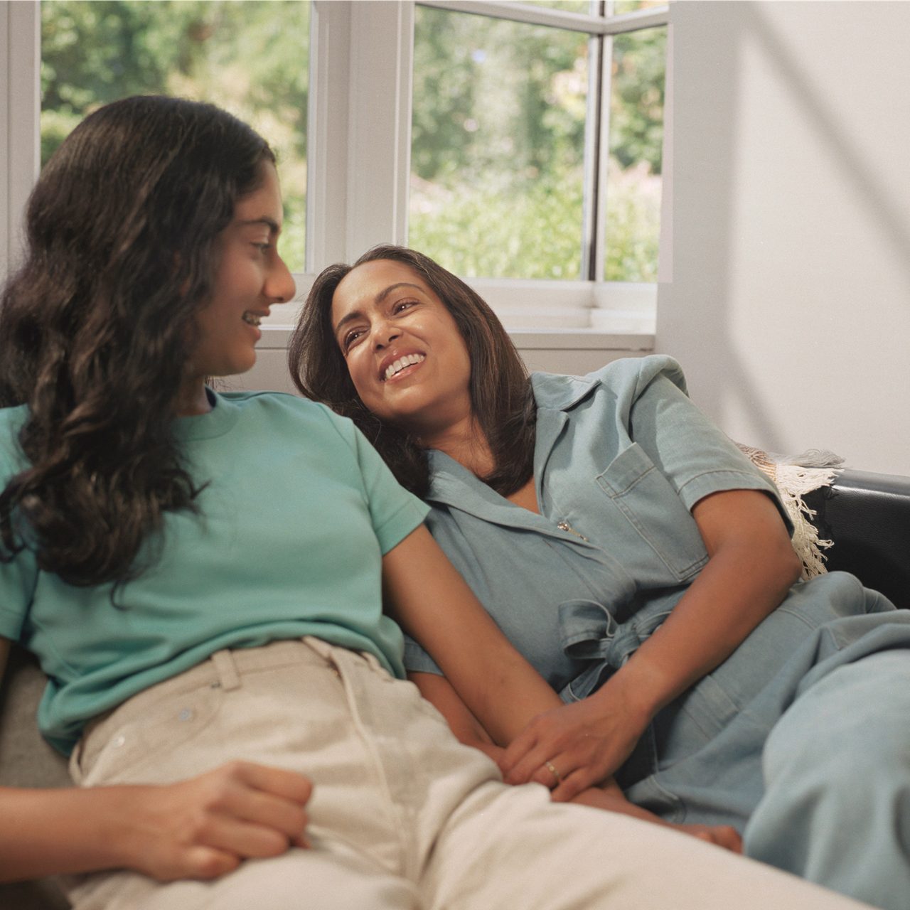 A mother and daughter engage in conversation, illustrating how crucial it is to understand the impact of VMS on women’s health.