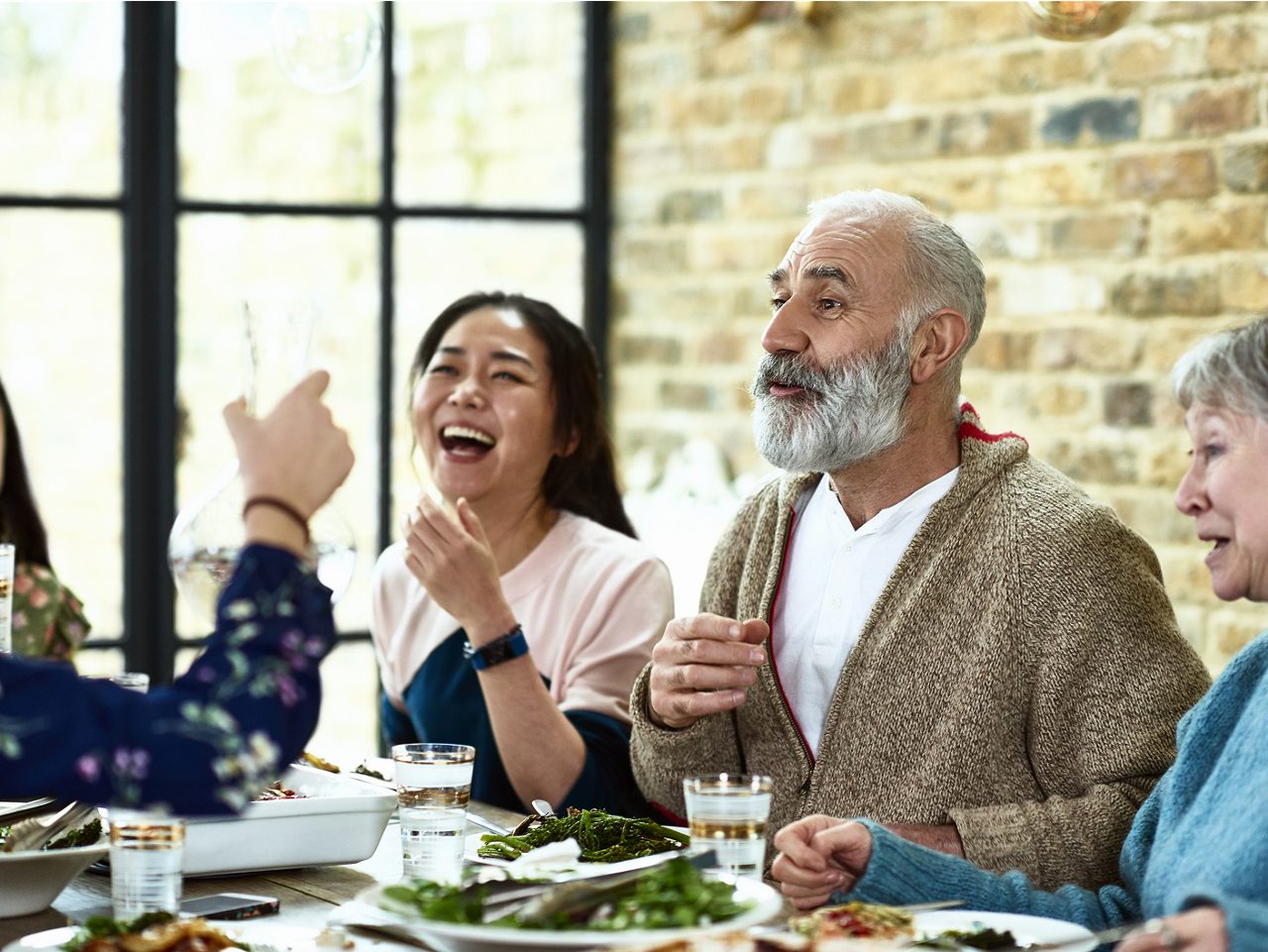 A patient surrounded by loved ones shows Astellas’ focus on improving quality of life with real-world treatment impact.