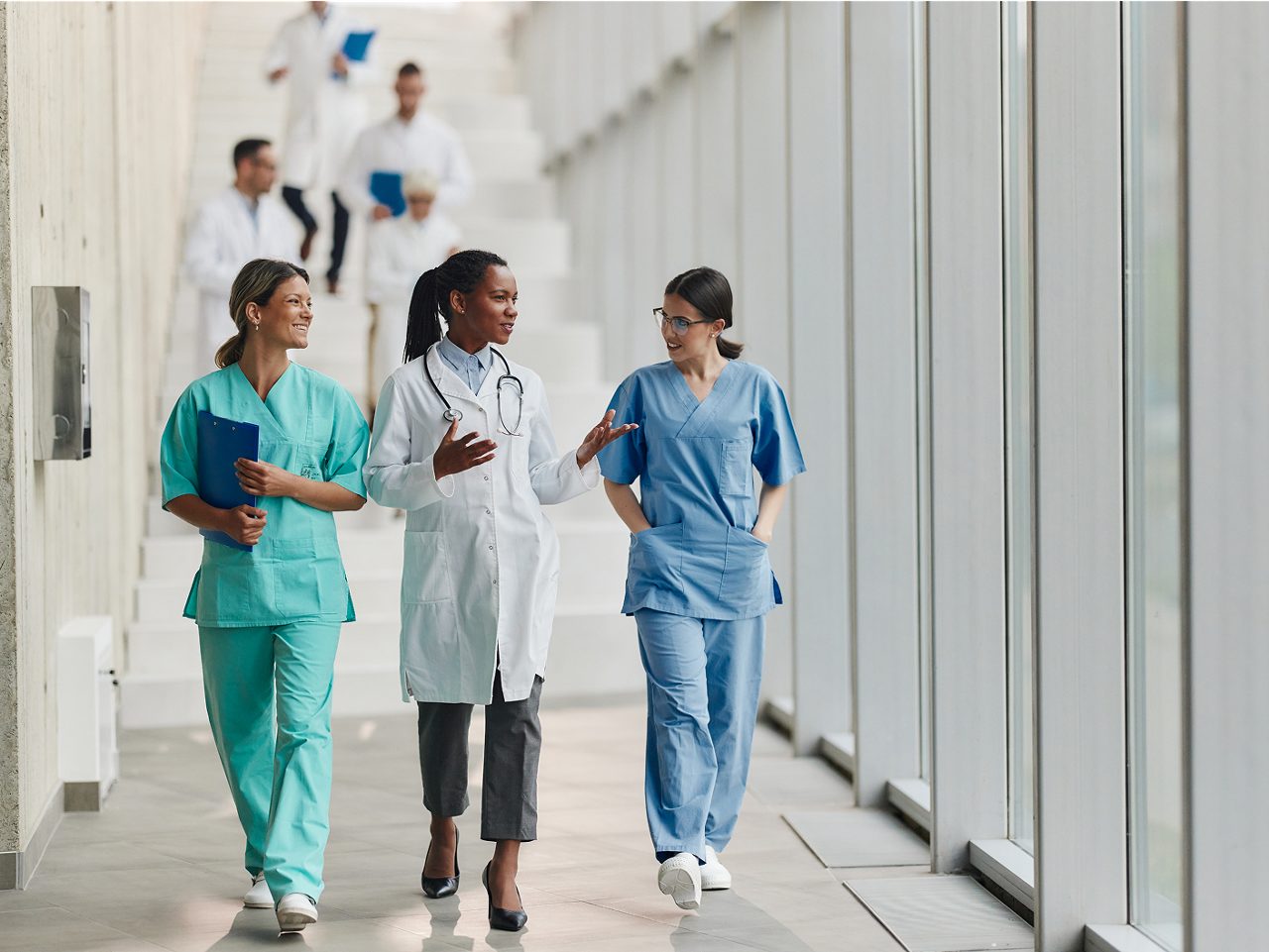 A group of healthcare professionals in discussion, highlighting Astellas’ commitment to collaborative, patient-focused care.