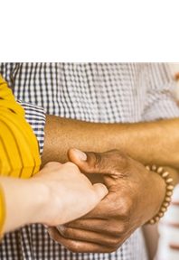 A family embraces hands, illustrating Astellas’ focus on providing patients with access to healthcare.