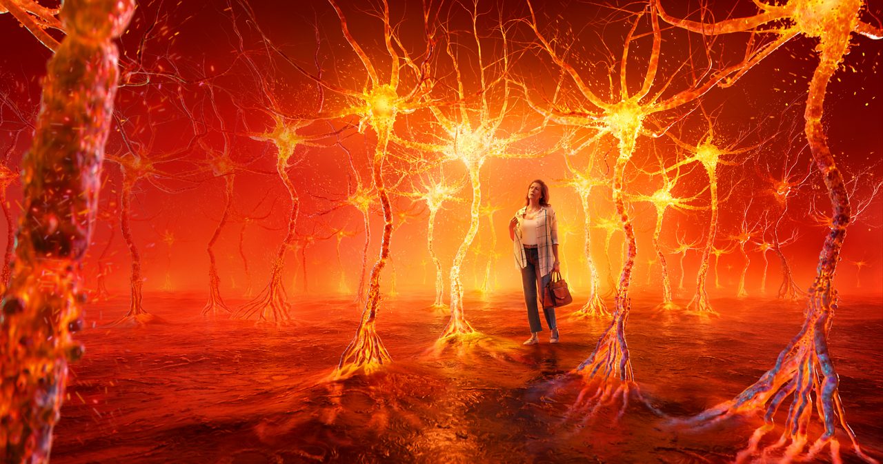 Woman walking in fiery neuron forest