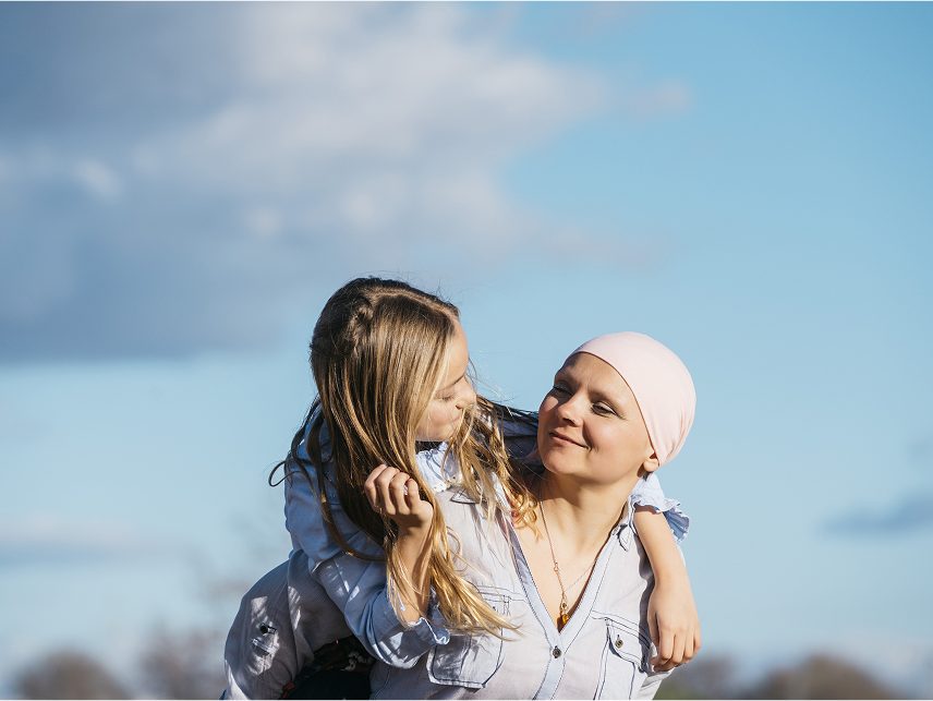  A cancer patient embraces her daughter, highlighting Astellas’ commitment to transformative oncology therapies.
