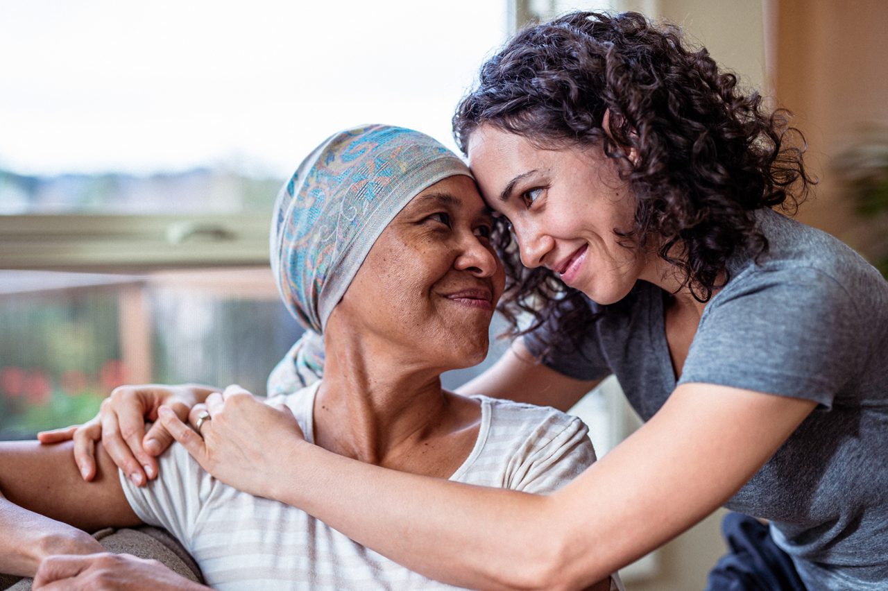 Two women embrace, expressing Astellas’ commitment to therapies that have transformed the lives of millions of patients.