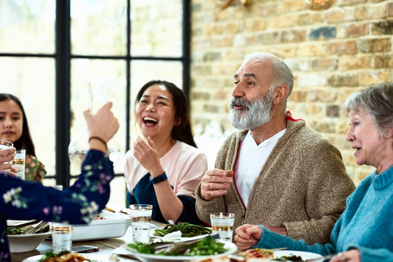 A patient surrounded by loved ones shows Astellas’ focus on improving quality of life with real-world treatment impact.