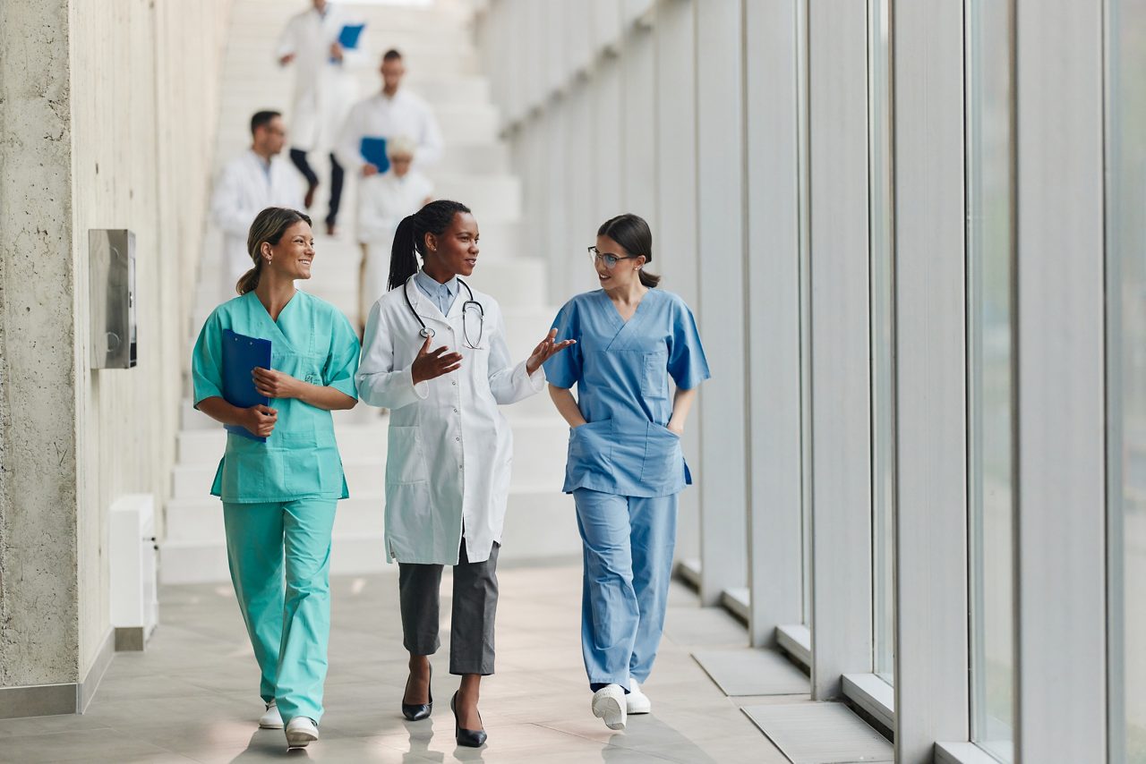 A group of healthcare professionals in discussion, highlighting Astellas’ commitment to collaborative, patient-focused care.