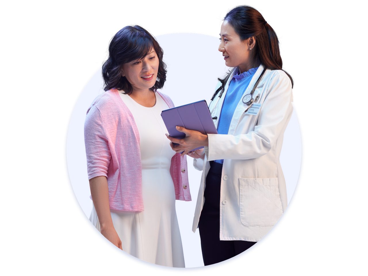 Woman and doctor looking at iPad