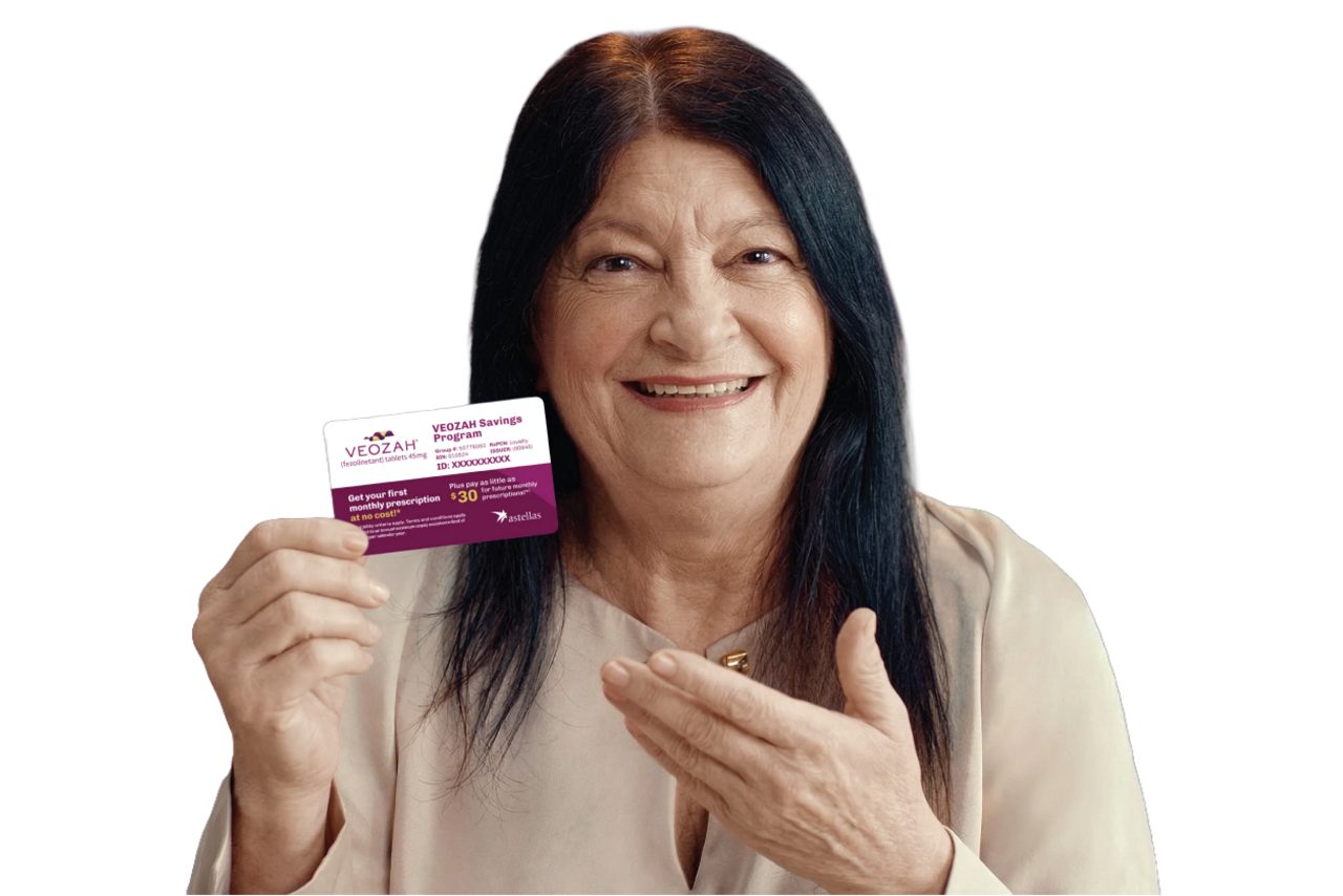 Annet holding a VEOZAH™ savings card