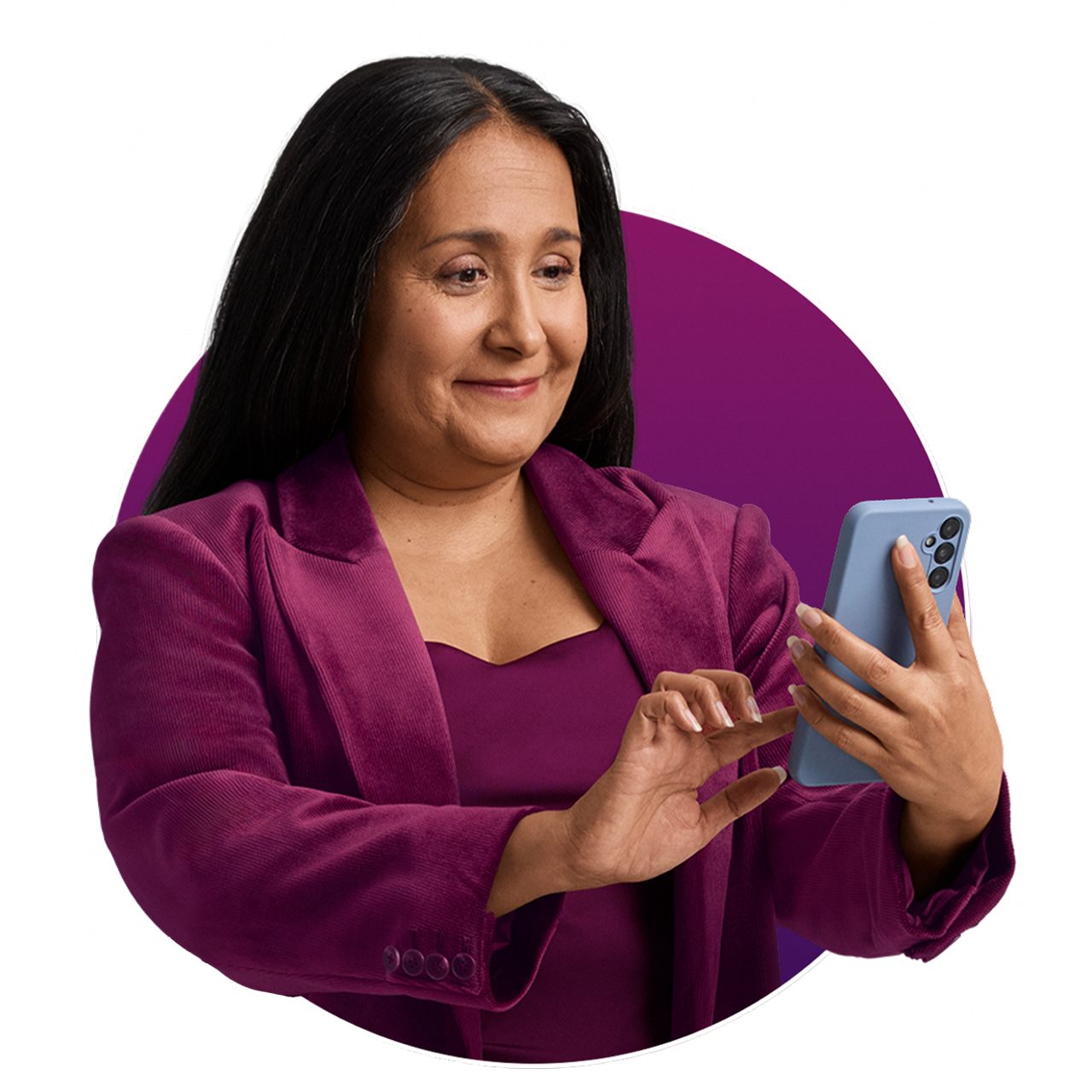 A woman holding a phone and smiling