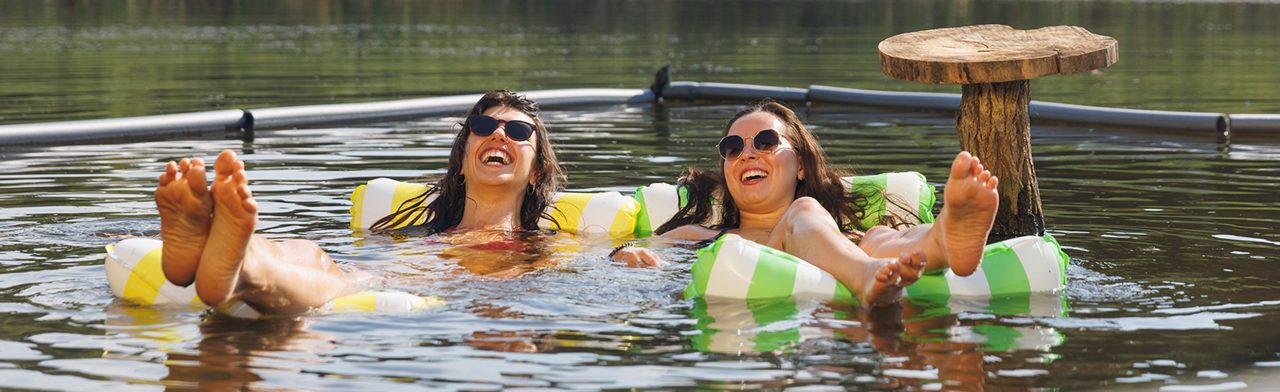 Three women talking and smiling