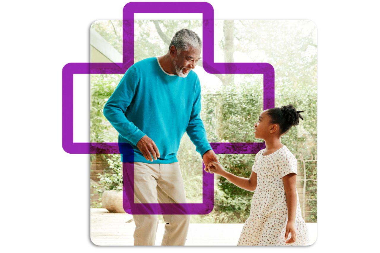 Grandfather and granddaughter holding hands
