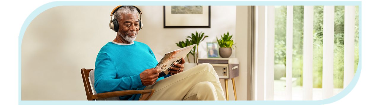 Man sitting in a chair reading
