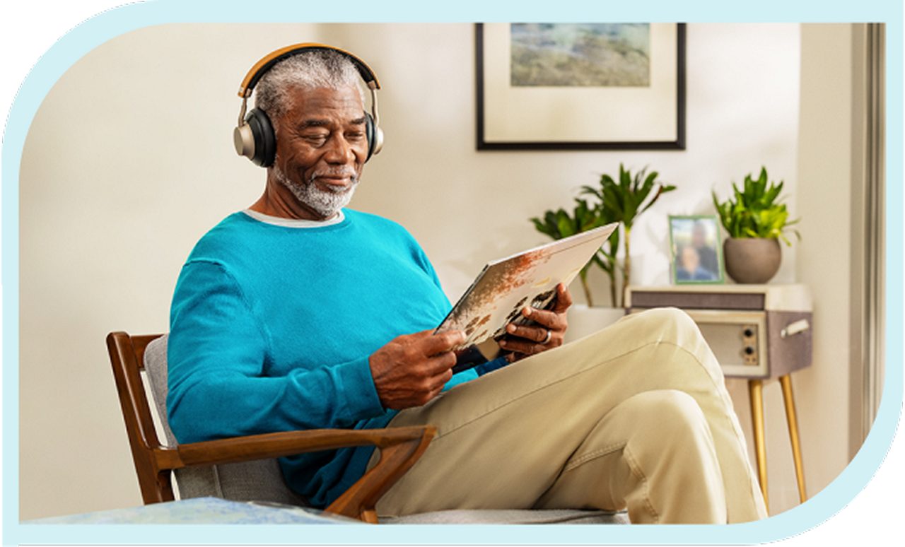 Man sitting in a chair reading