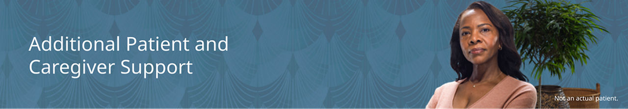 Woman standing in front of a small tree.