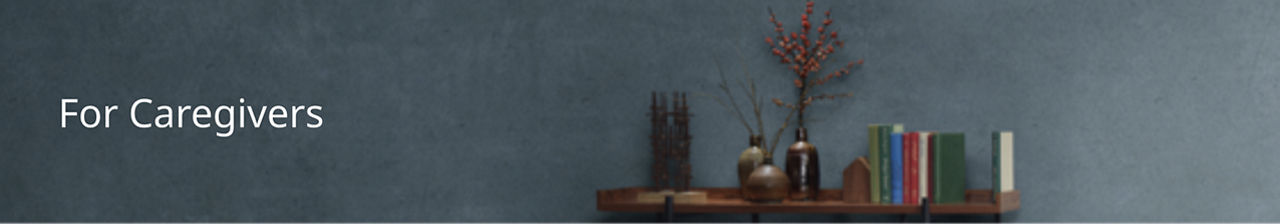 Bookshelf with books and flowers.