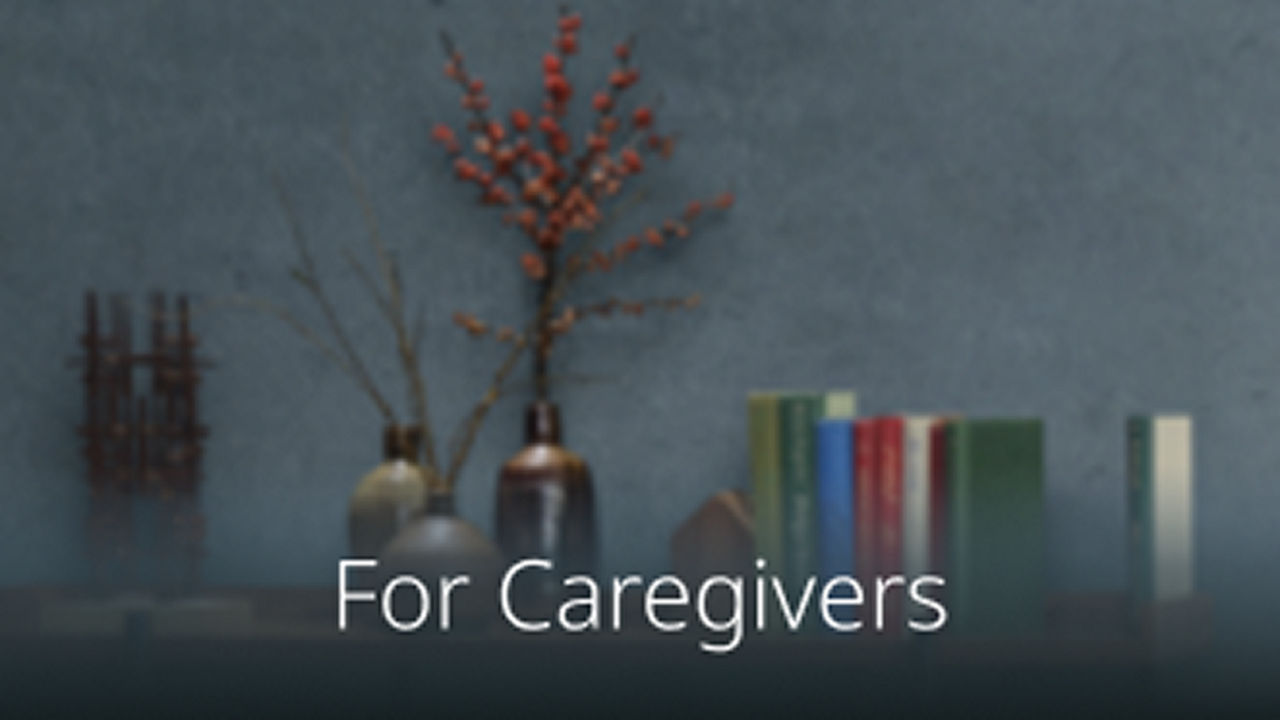 Bookshelf with books and flowers.